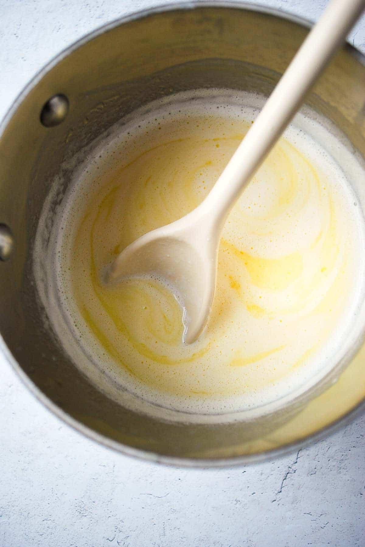 melted cheese mixture in a saucepan