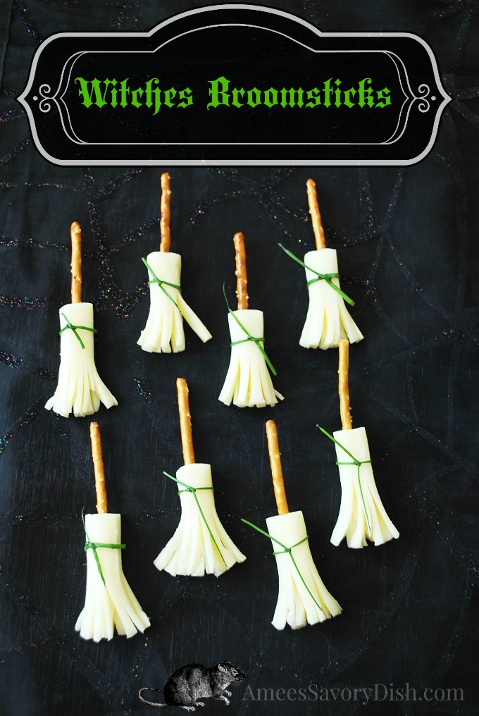 A healthy Halloween snack recipe for Cheesy Witches Pretzel Broomsticks that are fun for kids to eat and make with only three simple ingredients! #halloweenfood #healthyhalloweensnacks via @Ameessavorydish