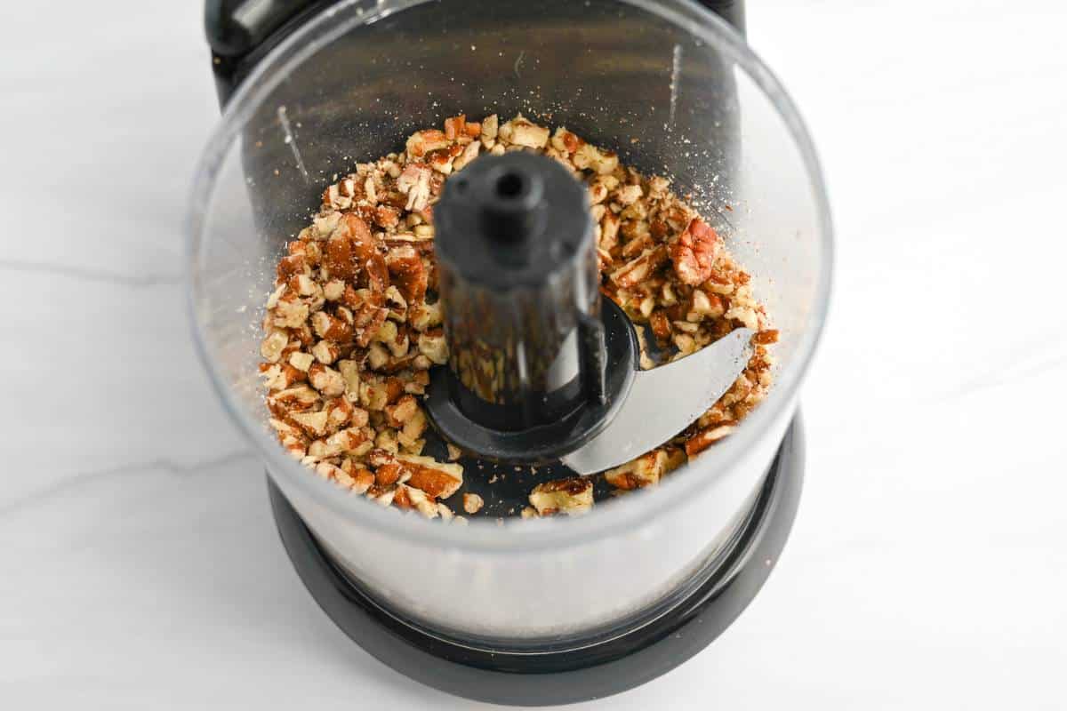 chopped pecans in a mini food processor