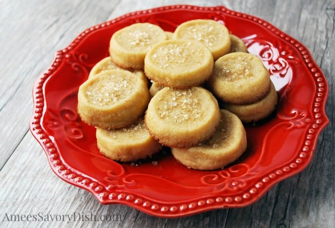 Cookies sprinkled with coarse sugar on a red plate