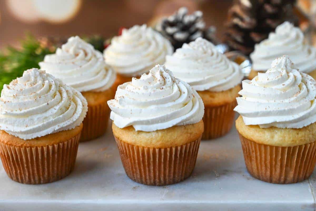 close up of eggnog cupcakes with nutmeg on top