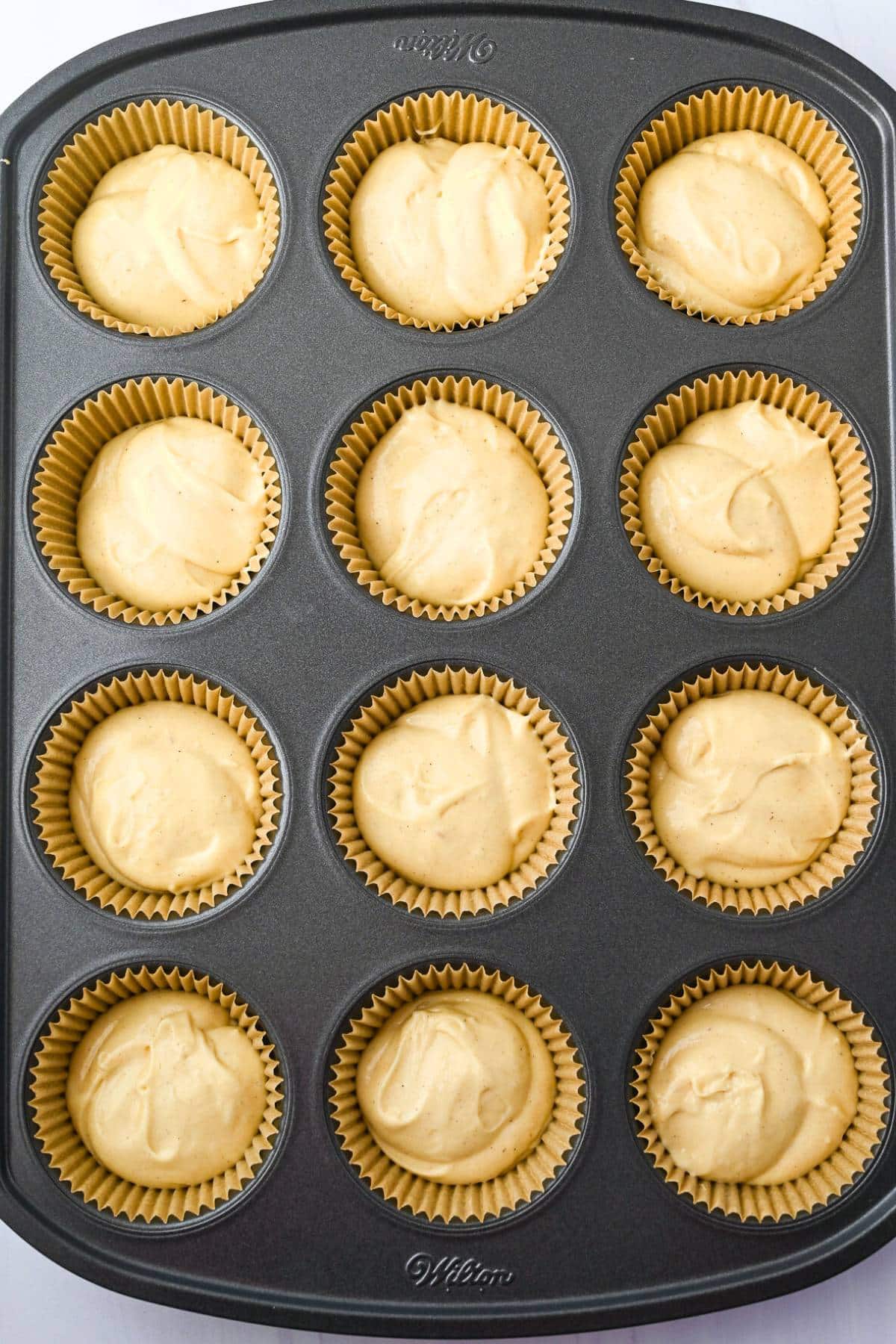 cupcake batter in liners ready to bake