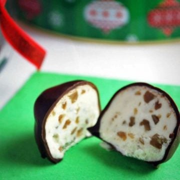bourbon ball sliced in half showing the nut confection filling