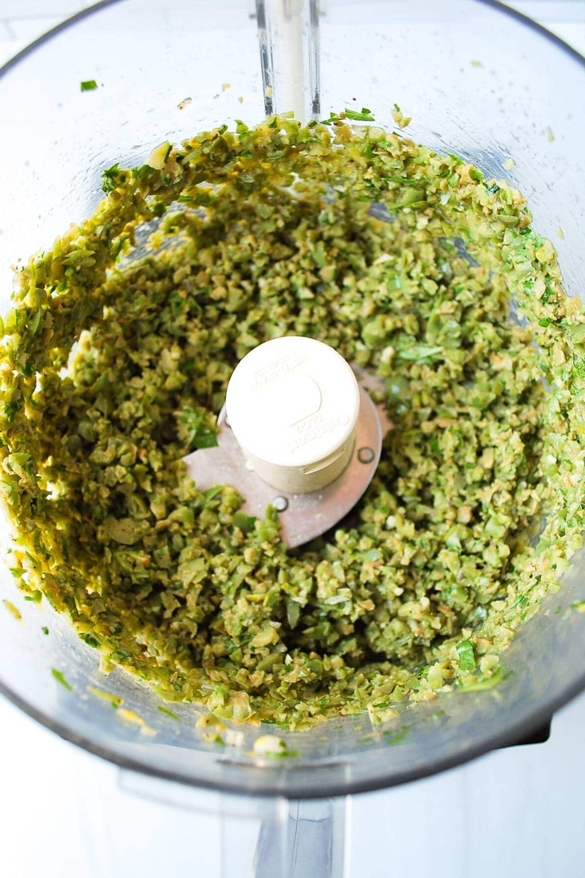 green olives, capers, lemon, and herbs pulsed in a food processor.
