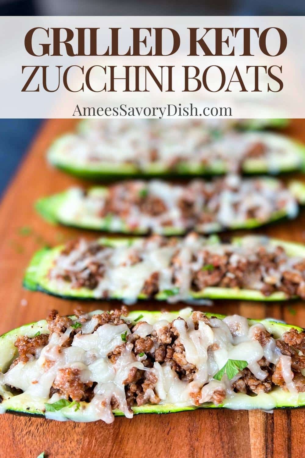 A simple recipe for "pizza" keto zucchini boats stuffed with a blend of ground beef and Italian sausage topped with melted cheese. via @Ameessavorydish