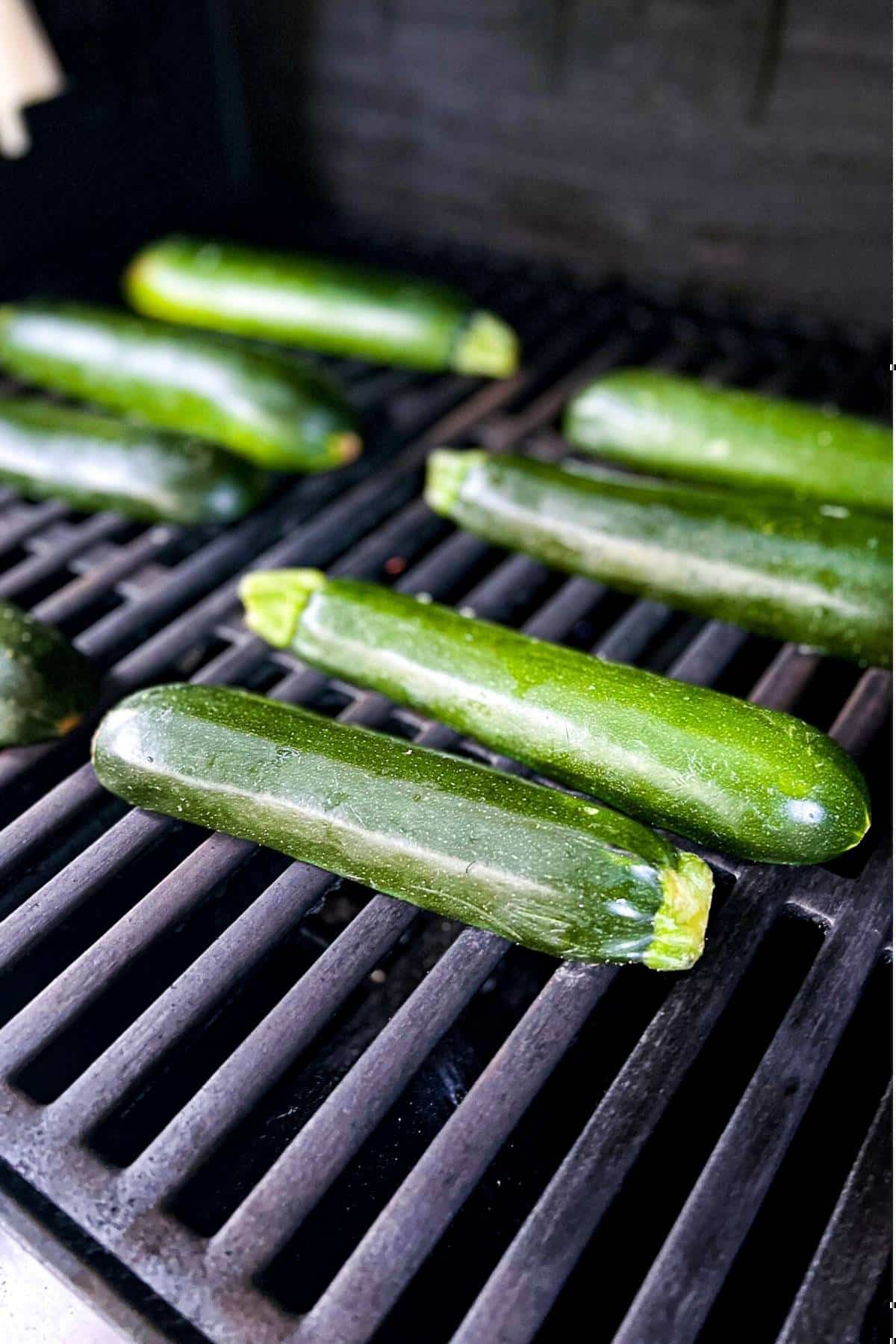 zucchini skins cooking on a grill