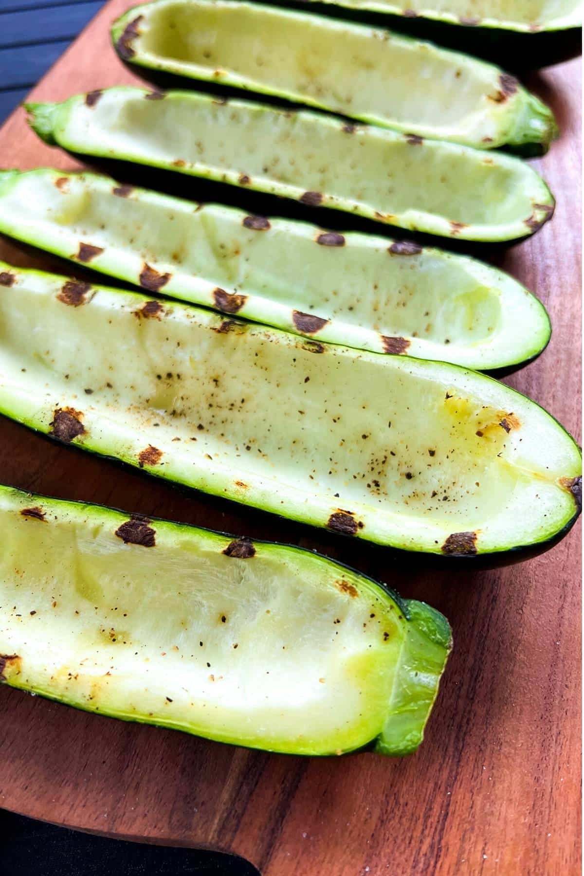 hollowed out zucchini skins with grill marks ready for stuffing