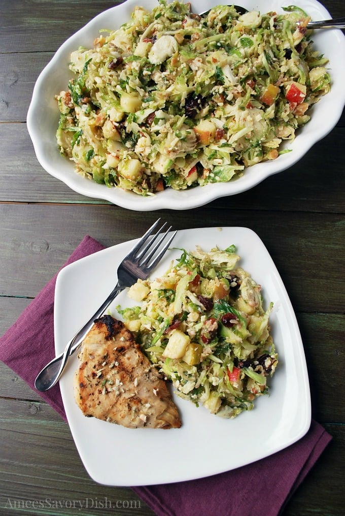 A recipe from Amee's Savory Dish for shaved brussels sprouts salad made with smoked almonds, apples, and shredded brussels sprouts. via @Ameessavorydish