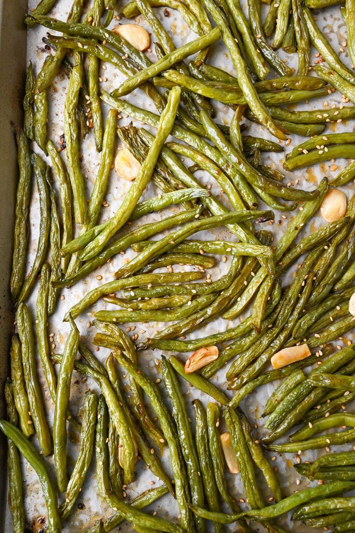 roasted green beans on a baking sheet 