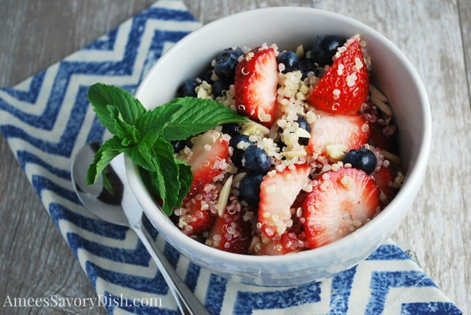 Berry and quinoa salad in a bowl with fresh mint 