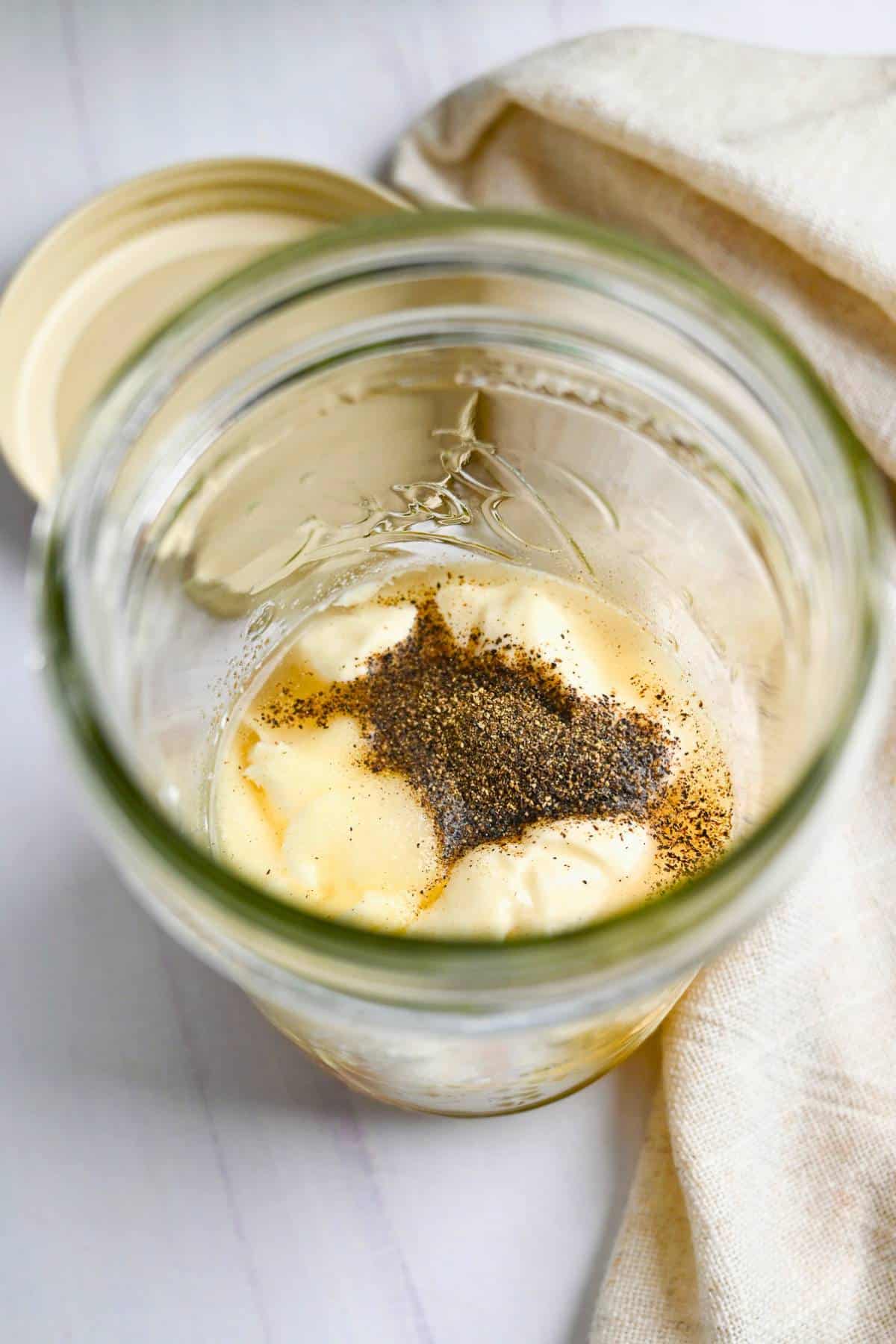 slaw dressing ingredients in a mason jar