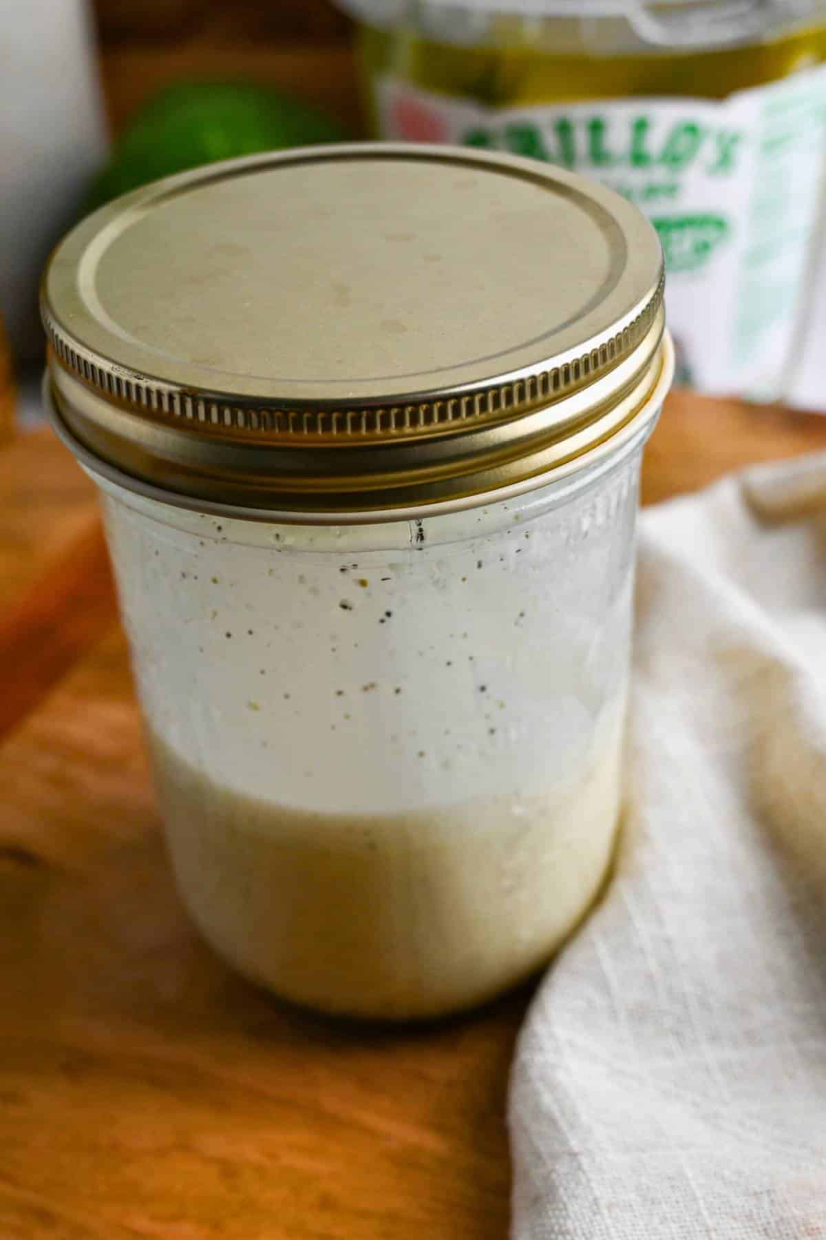 mixed slaw dressing in a mason jar
