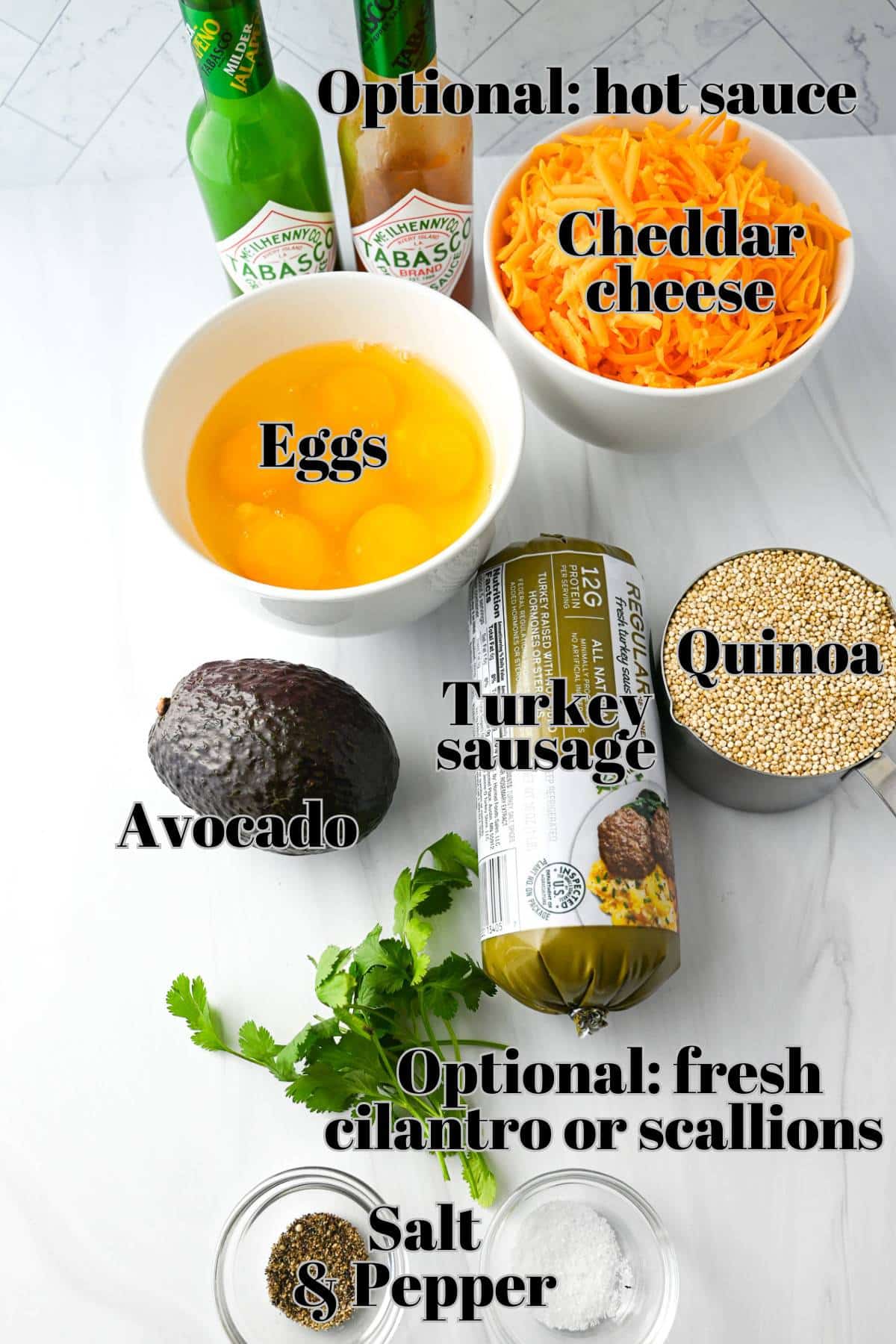 ingredients measured out on a counter for making quinoa breakfast bowls with egg, cheese, and avocado