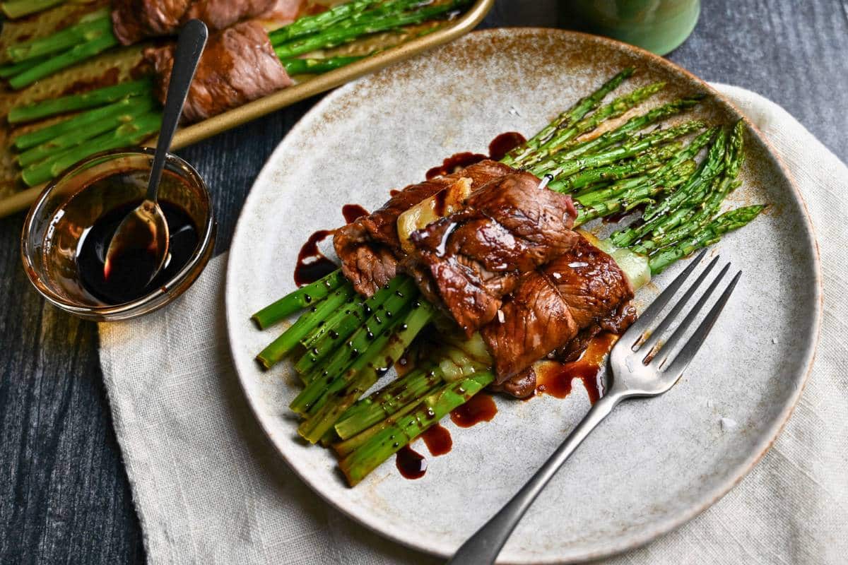 steak rolls on a plate with a fork and napkin
