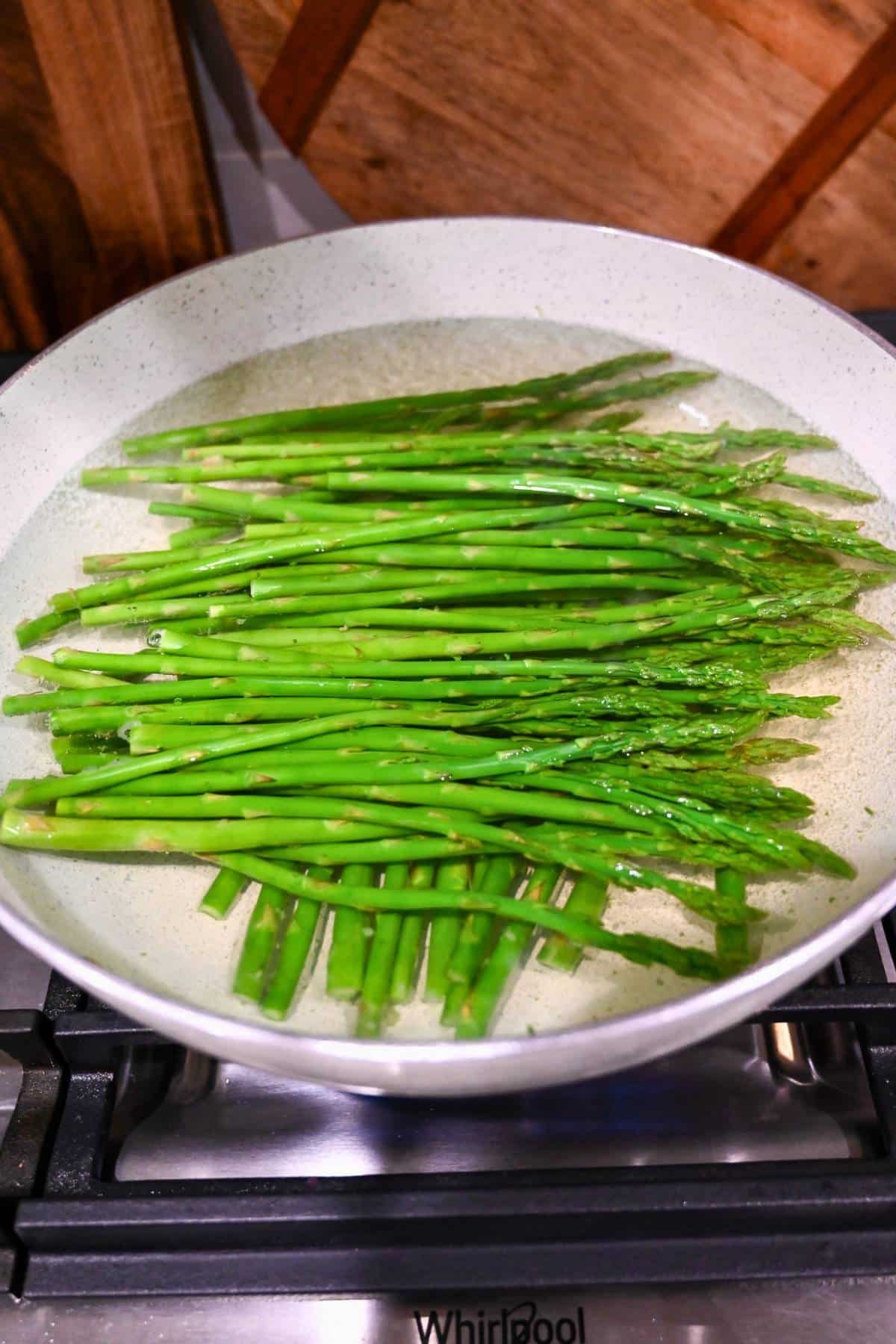 boiling asparagus in a saucepan
