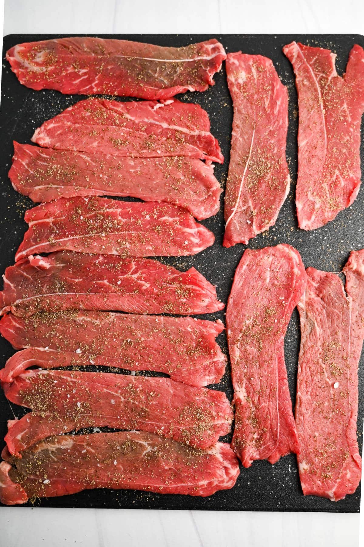 steak slices seasoned with salt and pepper
