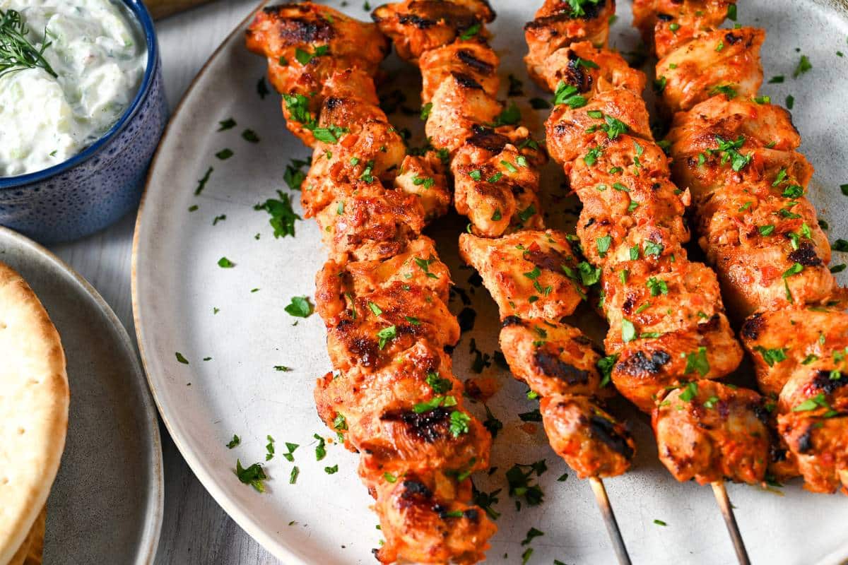 close up of grilled harissa chicken skewers