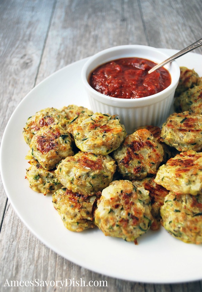 Zucchini Tots on a plate with dipping sauce