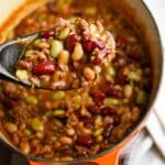 holding up a spoonful of baked beans