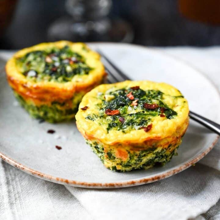 2 spinach and feta egg muffins on a plate