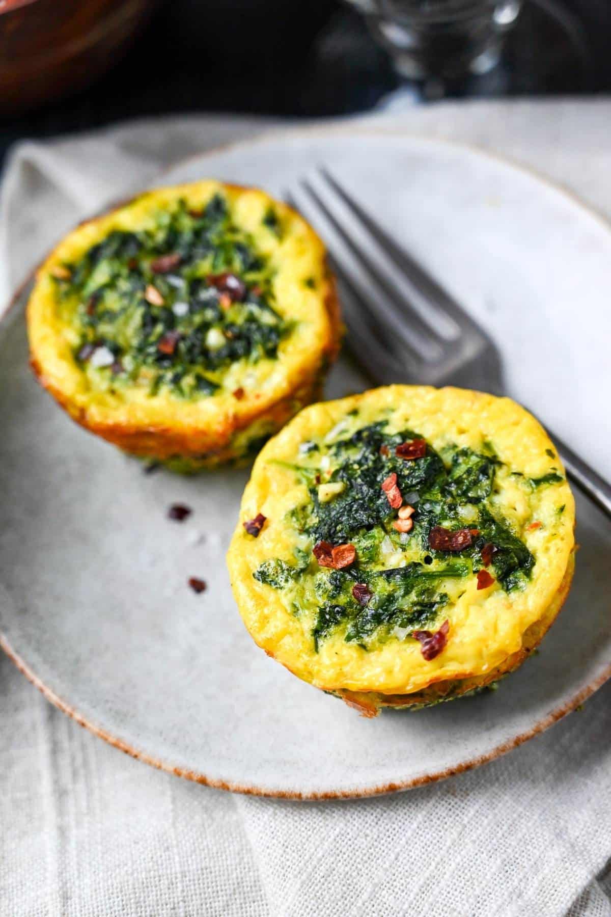 A quick and easy protein-packed recipe for Spinach and Feta Egg Muffins- perfect for meal prep and busy mornings! via @Ameessavorydish