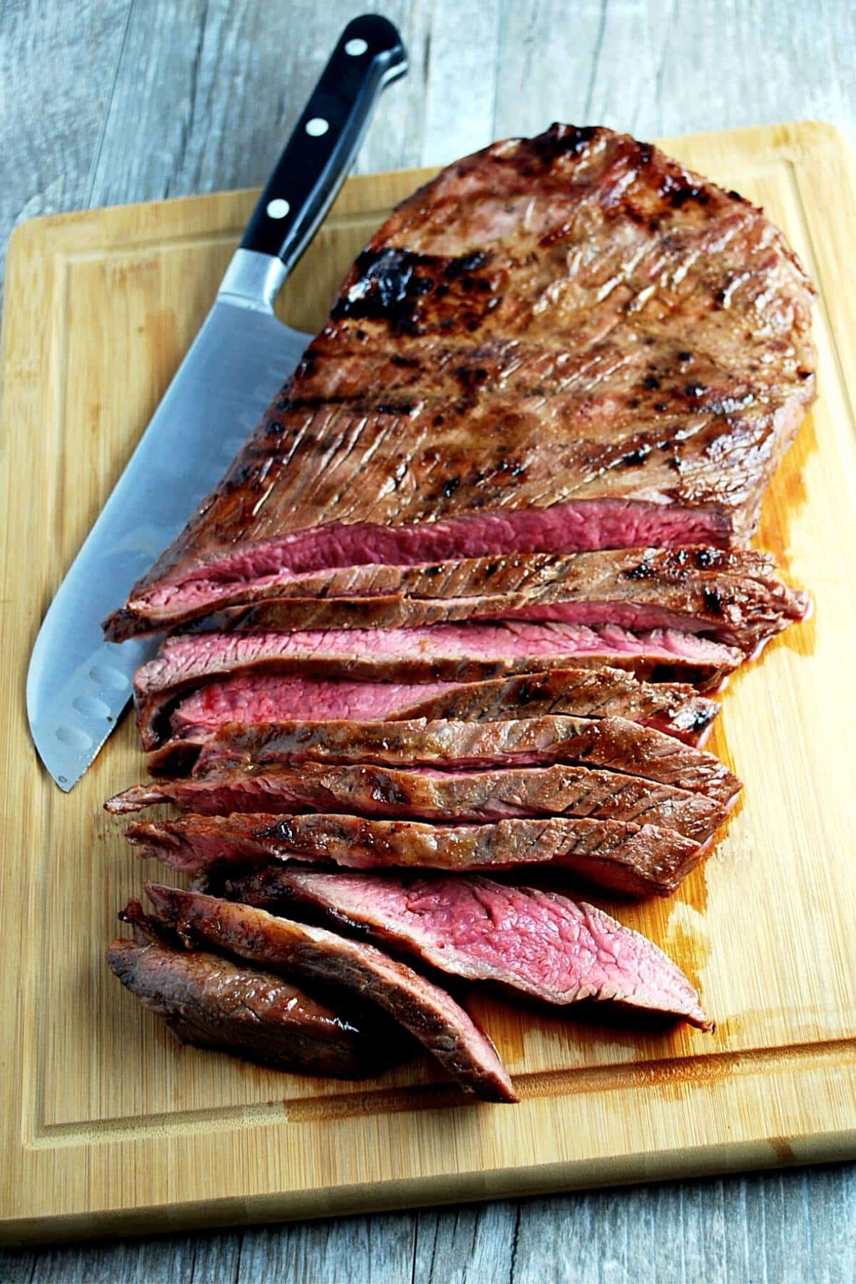 flank steak marinated in the best damn steak marinade and grilled