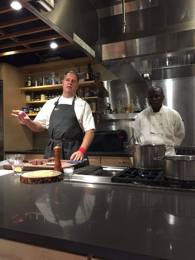 A man in a kitchen preparing food