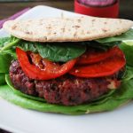 burger with lettuce, spinach and a flatbread wrap