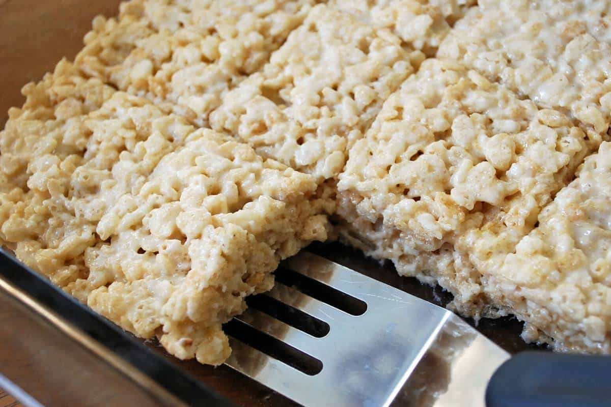 rice crispy treats sliced into squares in a 9x13 pan