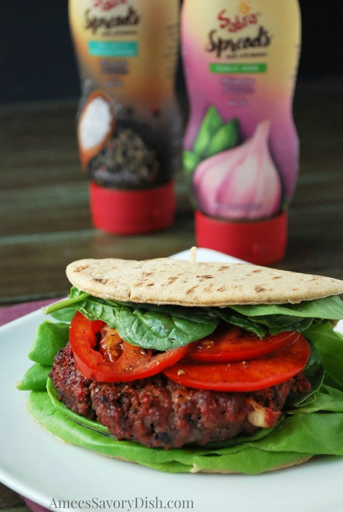 A delicious Mediterranean Burger Recipe made with lean ground beef, hummus, feta cheese, herbs and spices that is moist and delicious!  