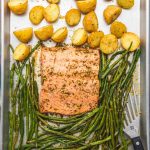 salmon with green beans and potatoes on a sheet pan