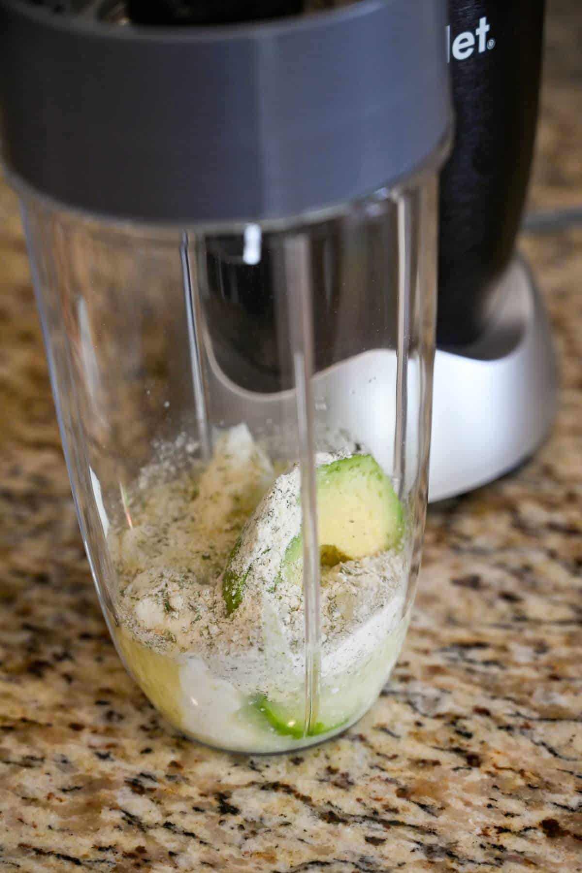 avocado lime ranch dressing ingrediens in a mini blender container