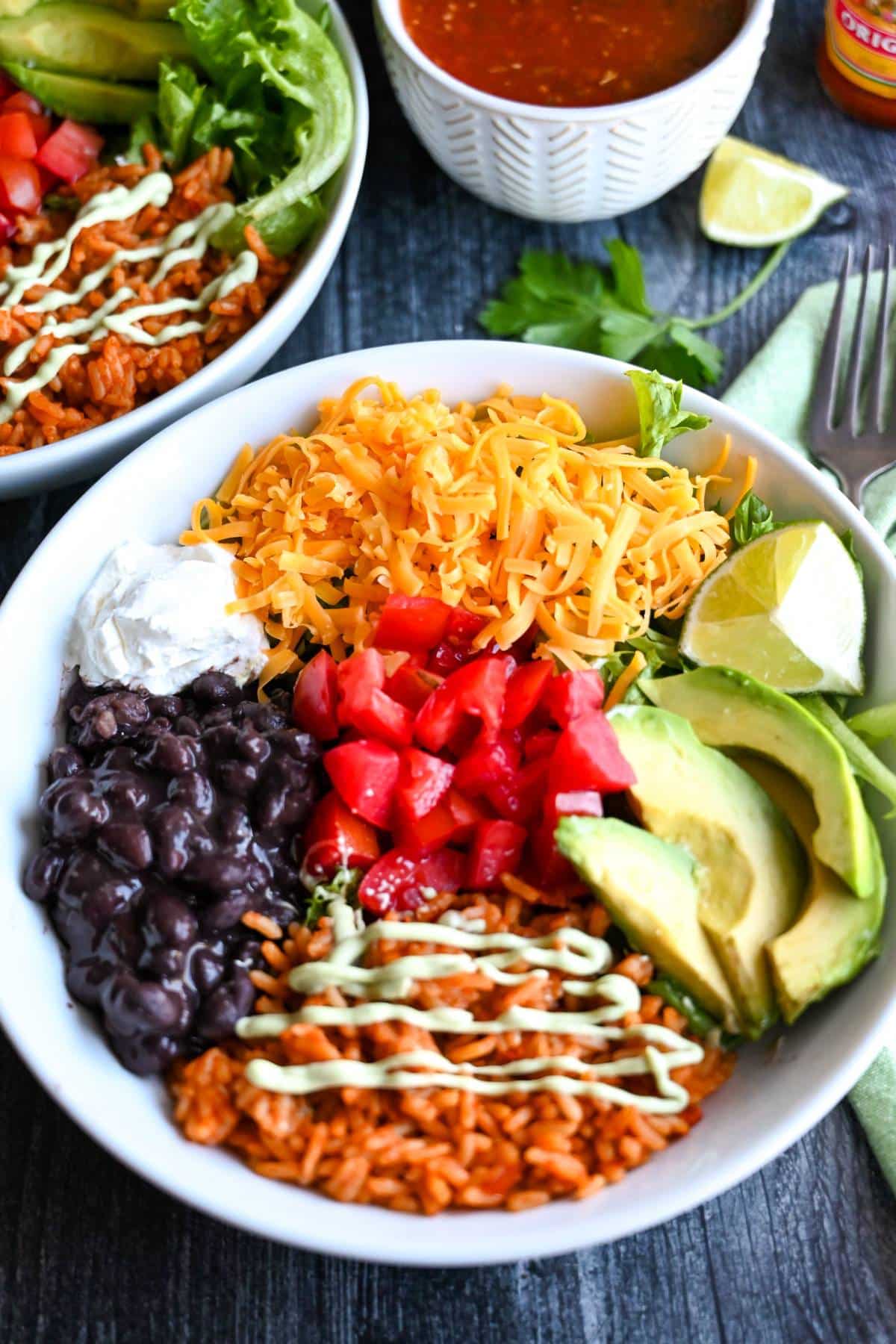 avocado lime ranch dressing drizzled on top of veggie bowls