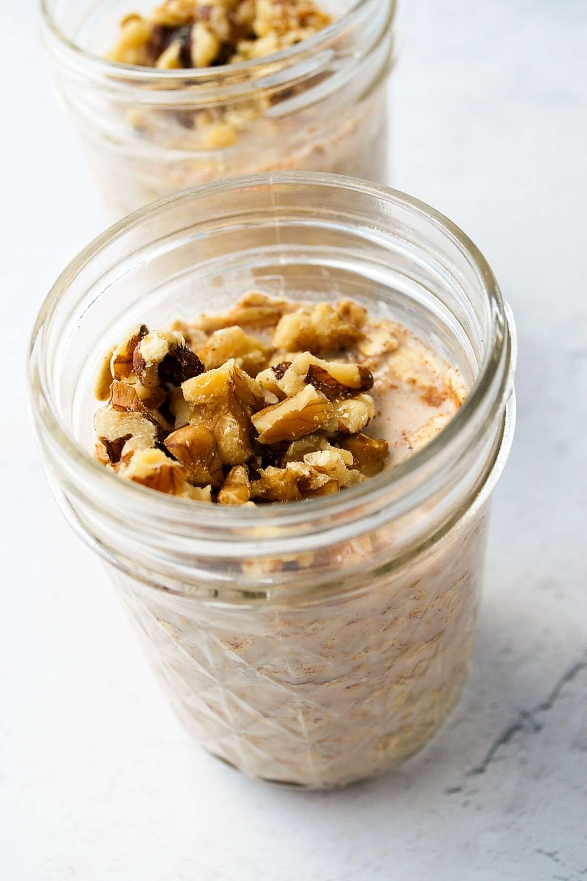 overnight oats in a jar topped with walnuts