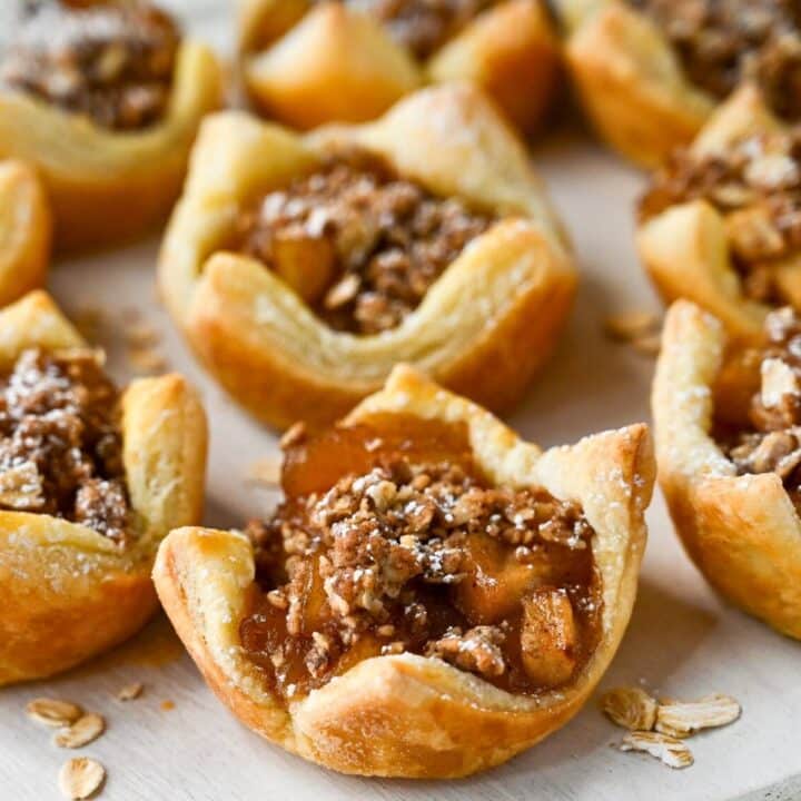 apple tarts with crumble and powdered sugar