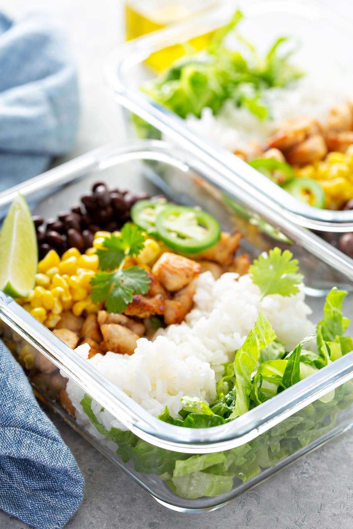meal prepped food in glass containers