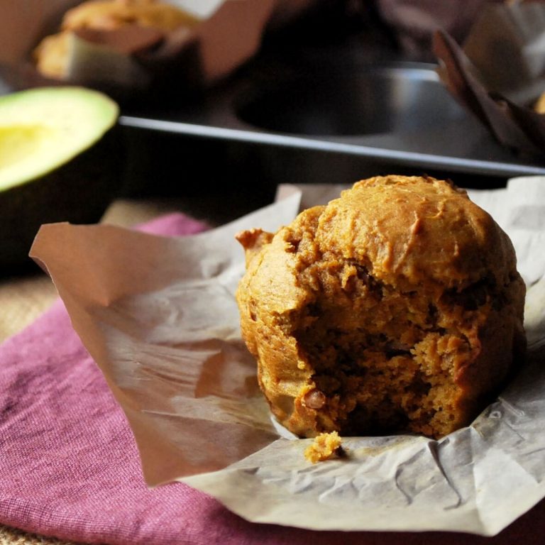 avocado pumpkin muffin with a bite taken out of it