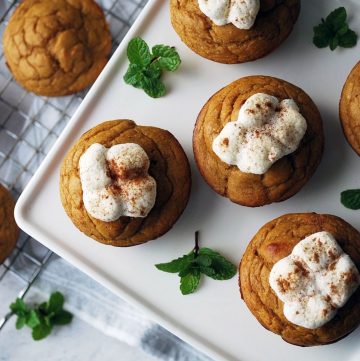 sweet potato muffins on a platter topped with melted marshmallows and cinnammon