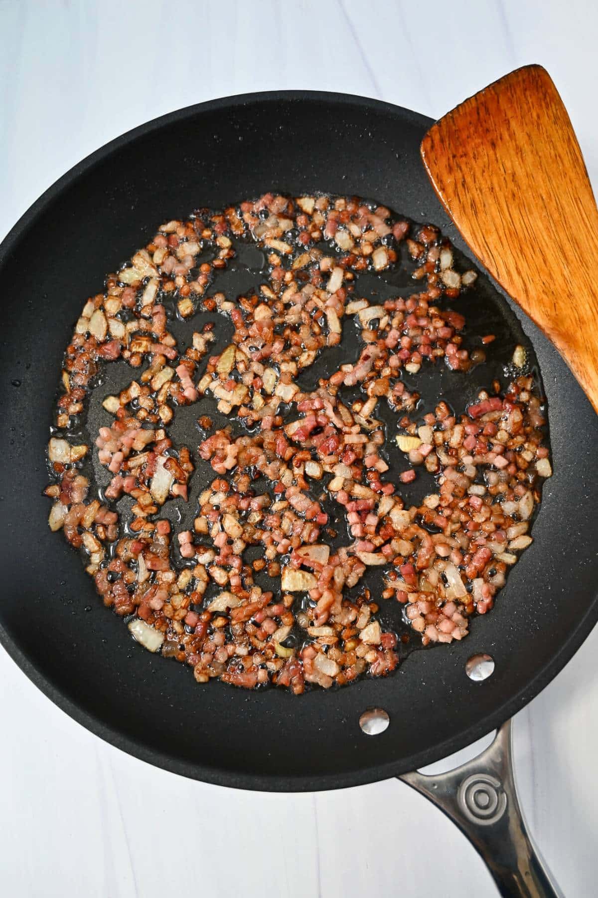sauteed pancetta in a skillet