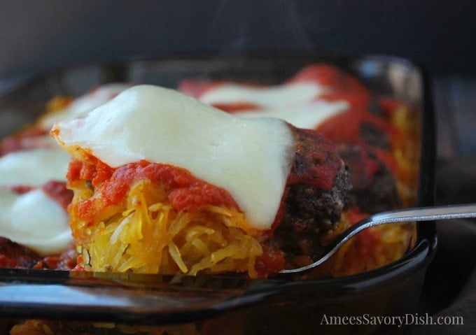 A close up of a spoonful of meatball casserole with spaghetti squash