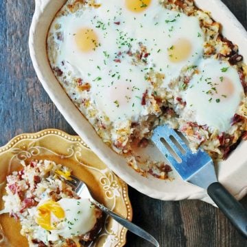 pan of corned beef hashbrown casserole with baked eggs on top