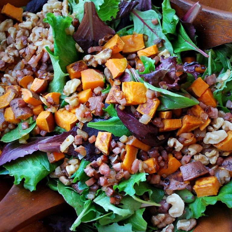 close up photo of sweet potato salad in a wooden serving bowl