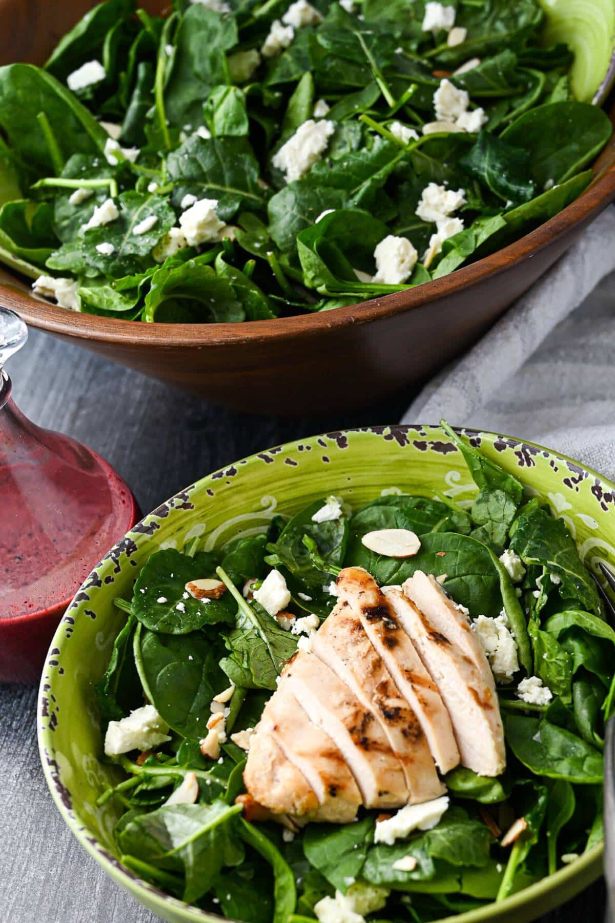 superfood kale spinach salad with a grilled chicken breast