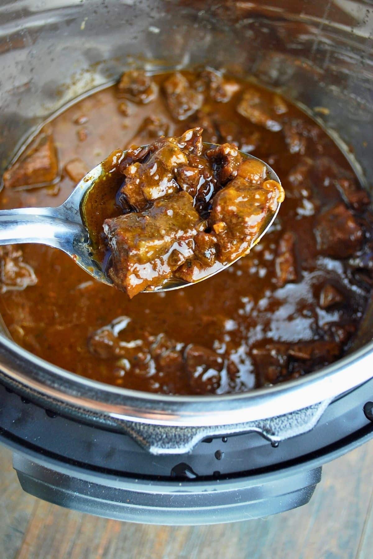 a spoonful of mediterranean beef in an instant pot