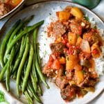 mango beef over rice with a side of green beans