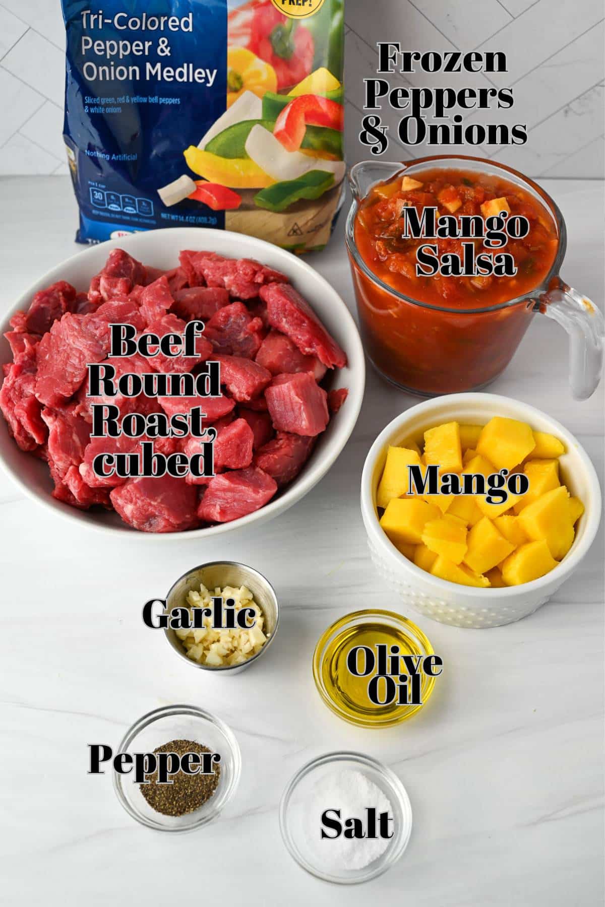 ingredients for making slow cooker beef with mangos and salsa measured out on a counter