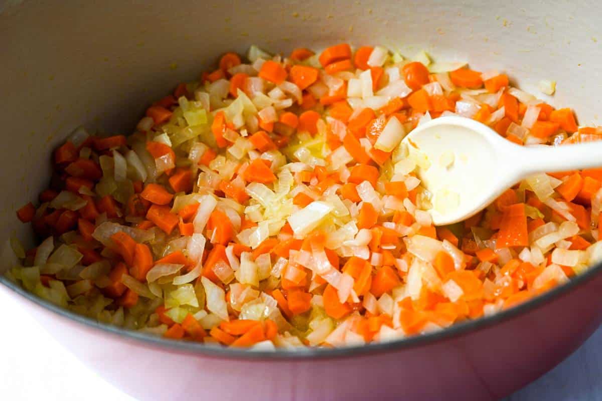 sauteed carrots and onions in a dutch oven
