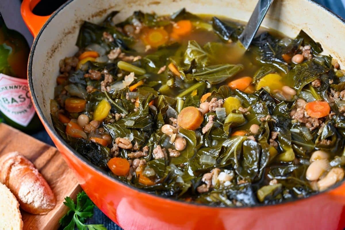 collard soup in an orange dutch oven