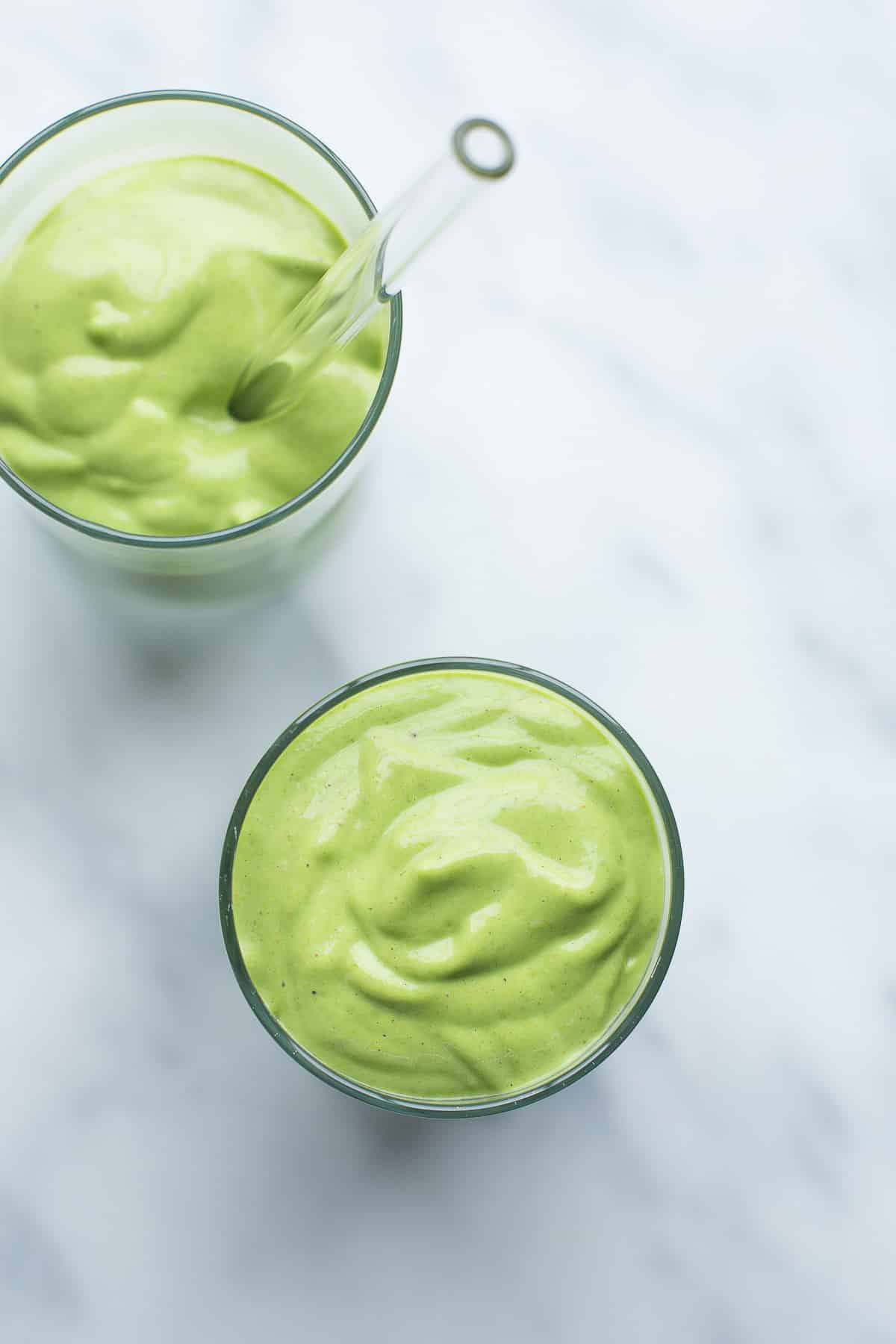 two smoothies in a glass