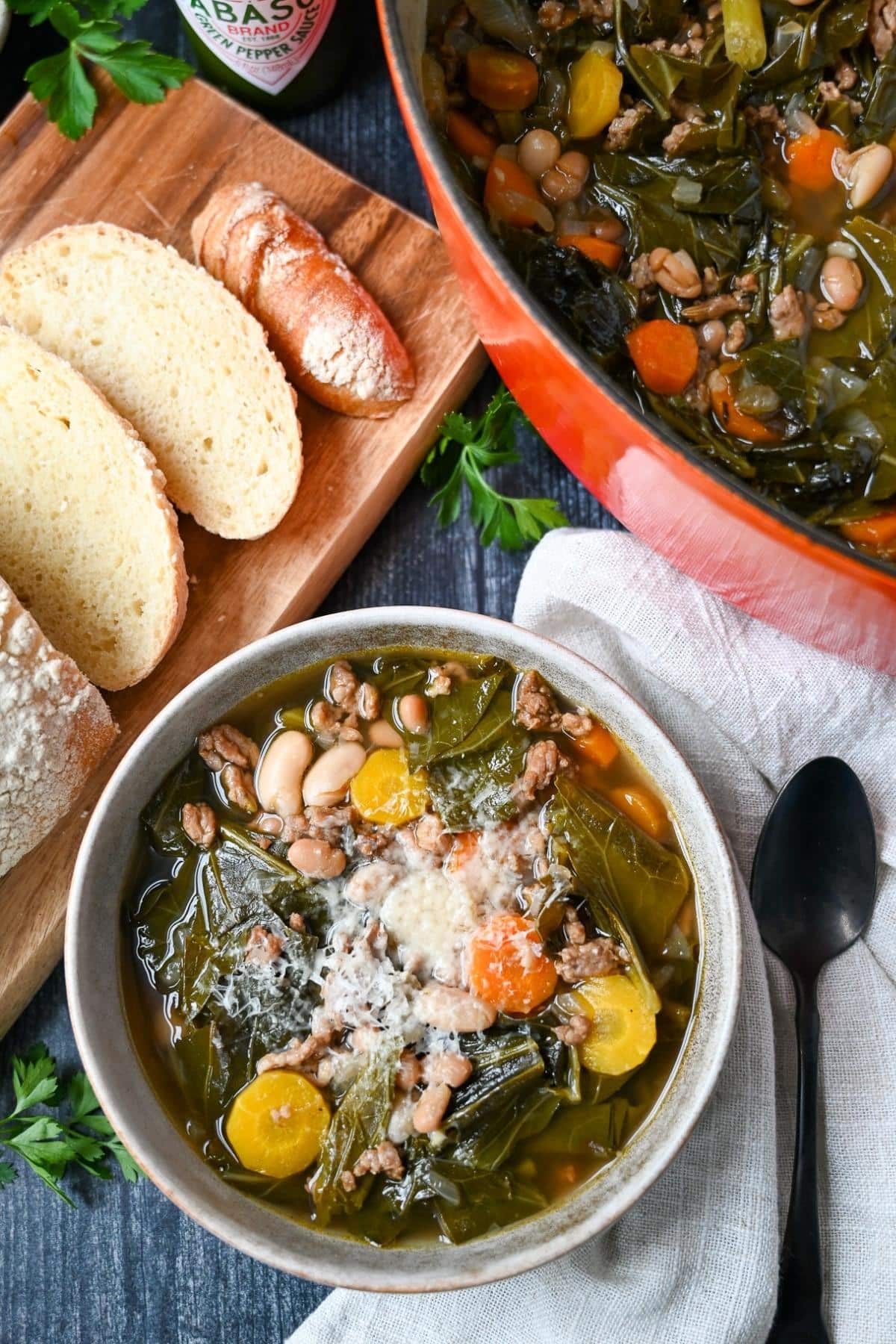 Warm up with a comforting bowl of Collard Green Soup with savory Italian sausage, white cannellini beans, and aromatic veggies. Stove-top, slow cooker, and Instant Pot instructions included. via @Ameessavorydish